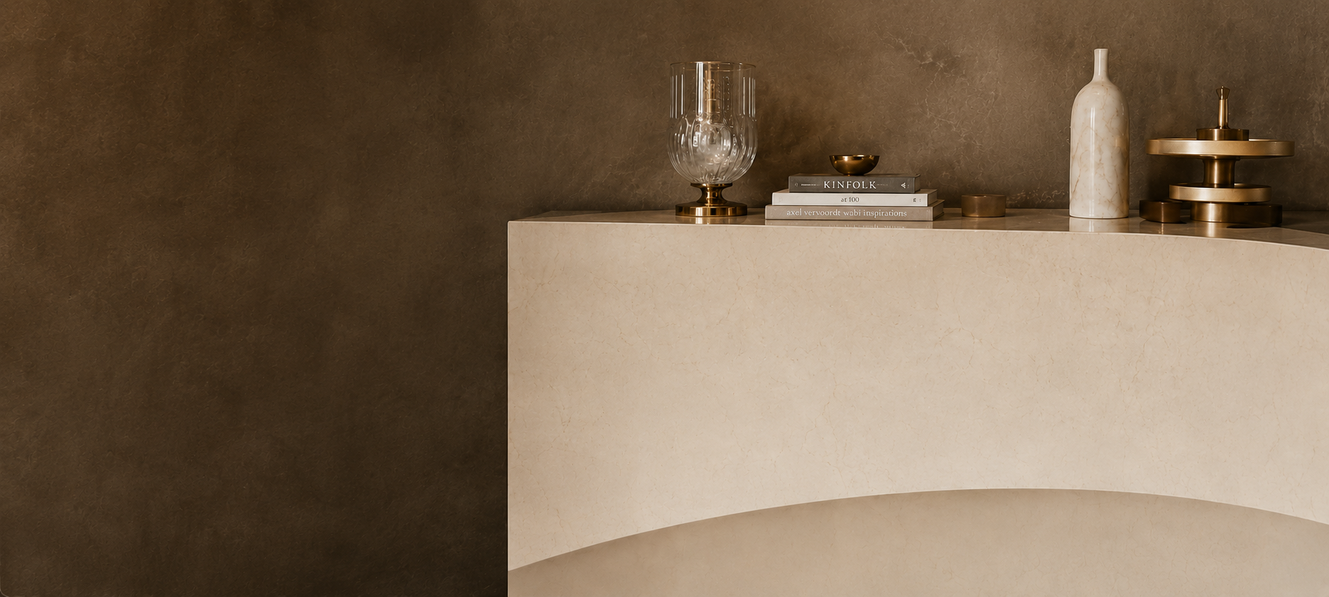 Elegant marble and metal display with curated decor pieces